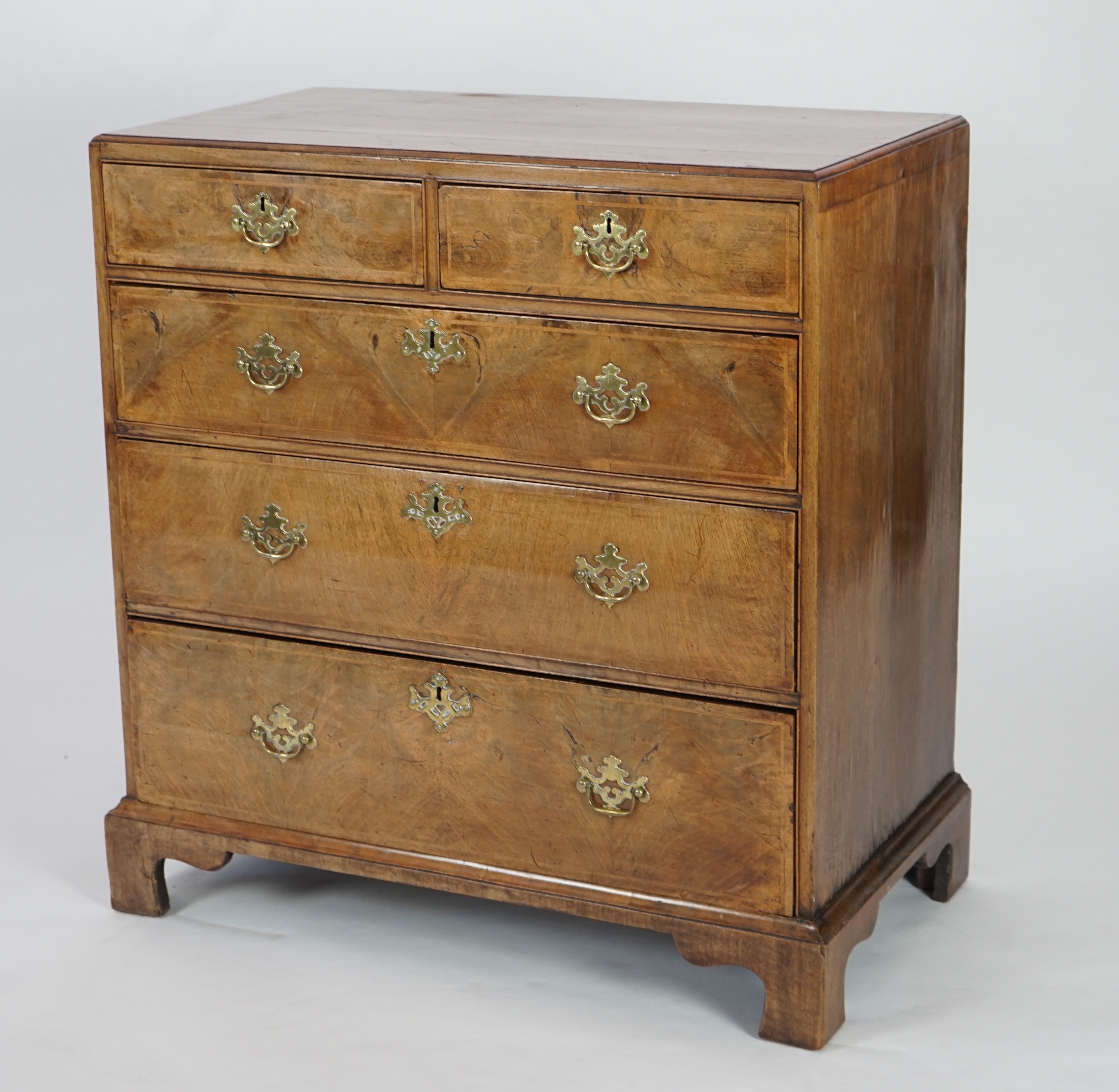 A George II walnut and feather banded caddy top chest